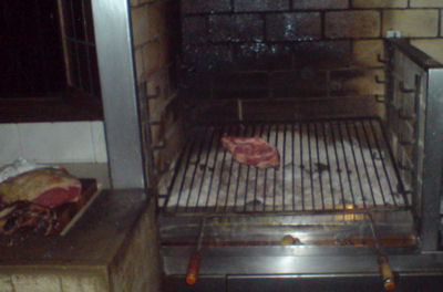 An ox chop being grilled