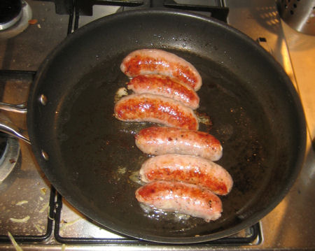 Some Sillfield Farm sausages looking delicious in a pan