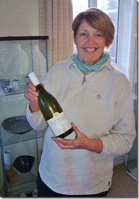 Jane Denley of Woodlands Jersey Beef with a bottle of Alain Chavy Puligny